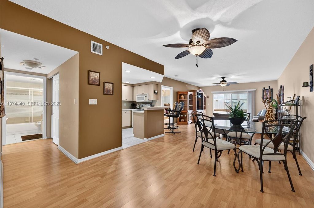 Photo of 4401 Crystal Lake Dr #101, Deerfield Beach, FL 33064 (MLS # A11974440)