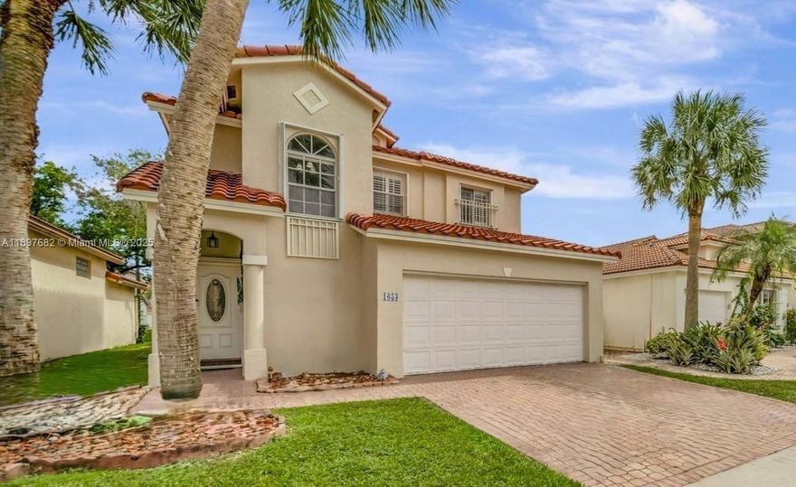 NEW ROOF 2024! Strong where it counts, warm where it matters—this Grand Palms 4-bed, 2.5-bath home pairs solid craftsmanship with modern comfort. Not just stylish or trendy, but built to last with granite stone counters, impact French doors, accordion & plantation shutters, and timeless materials throughout. The open layout brings light and flow, anchored by a main-level primary suite and 3 spacious upstairs bedrooms—4 REAL BEDROOMS! Solid bones, thoughtful design, and a “protective home” feeling in a pet-friendly, resort-style community. HOA includes cable, internet, ADT alarm, lawn, landscaping & more! Enjoy green space and walking paths only a Golf Course Community can offer—no street, just serenity. Private yet conveniently located near major roads, shopping centers, and restaurants.