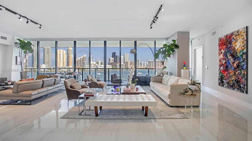 Experience luxury living in this exquisite corner unit at PRIVE Island. This stunning 4-bedroom, 4-bathroom residence spans over 3600 SqFt and has high-end finishes throughout. Enjoy breathtaking panoramic views of the ocean and inter-coastal from your home. This unit comes with 3 parking spaces, 2 storages, a staff room, and access to a private marina. Don't miss the chance to call this luxurious property your home. Revel in the extraordinary lifestyle offered by PRIVE, featuring 70,000 SqFt of indoor social spaces, 2 gyms, a private restaurant, massage treatment room, sauna, tennis court, toddlers' playroom, billiards table, and 2 beautiful pools.