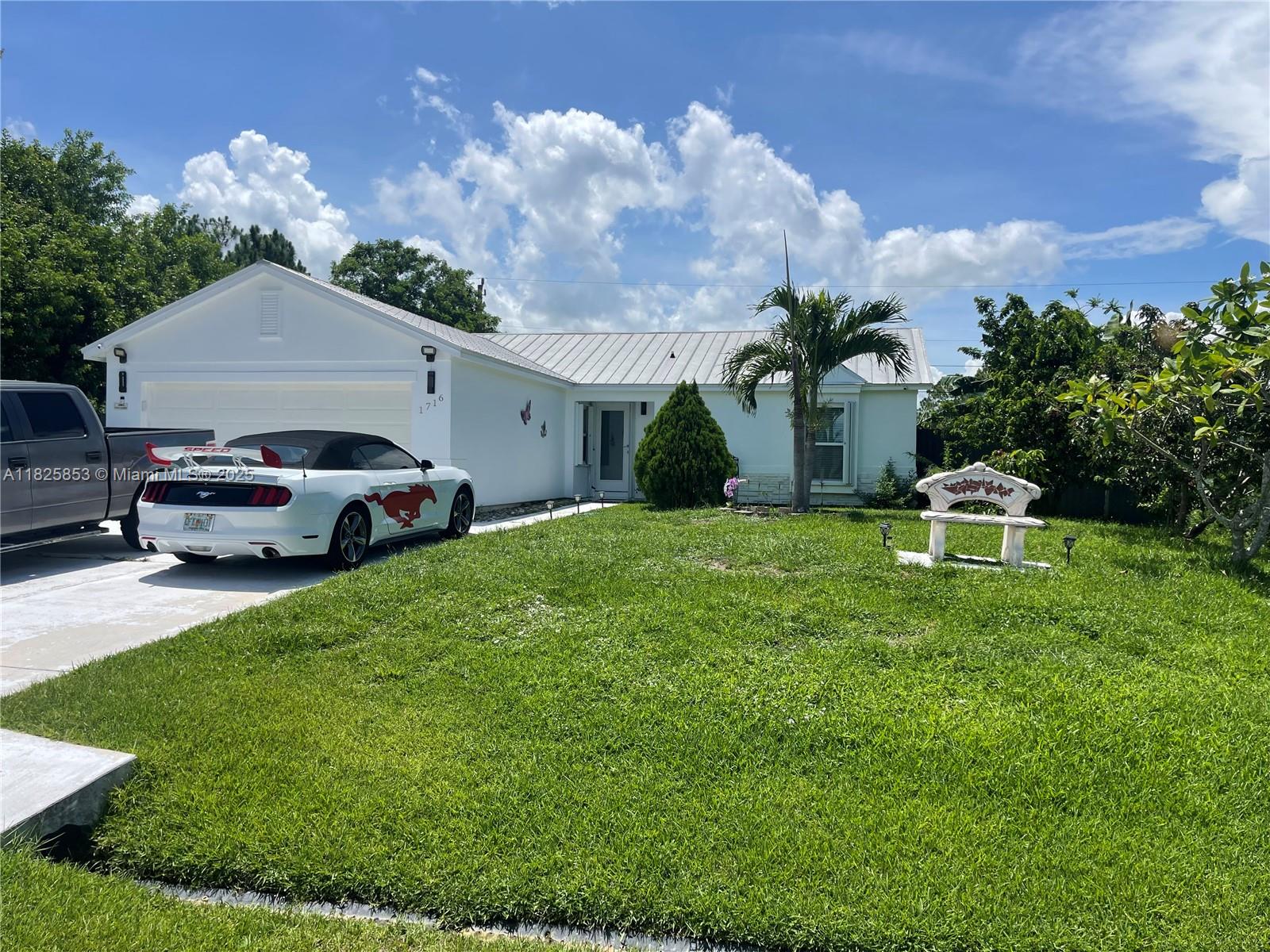 Just LISTED ! BEAUTIFUL 3 BEDROOM/2 BATH/2 CAR GARAGE HOME SITUATED IN THE WELL DESIRED AREA OF SW PORT SAINT LUCIE. THE HOME FEATURES A SPLIT PLAN, TILED THROUGH OUT, UPDATED BATHROOMS AND FRESHLY PAINTED.
HOME ALSO FEATURES A METAL ROOF, ACCORDION SHUTTERS FOR WORRY FREE HURRICANE PROTECTION AND A NICE SCREENED PORCH FOR BACK YARD RELAXATION AND OR WEEKEND BARBECUES. LARGE YARD HAS MANY FRUIT TREES SUCH AS MANGO, MAMEY, BANANAS, AVOCADO AND MORE PLUS PLENTY OF ROOM FOR RV/BOAT.
WASHER & DRYER NOT INCLUDED WITH SALE!
THE COMMUNITY IS LOCATED WITHIN CLOSE DISTANCE TO HIGH RATED SCHOOLS, SHOPPING, DINING & ENTERTAINMENT. THERE IS ALSO EASY ACCESS TO I-95. THIS HOME IS PRICED TO SELL!