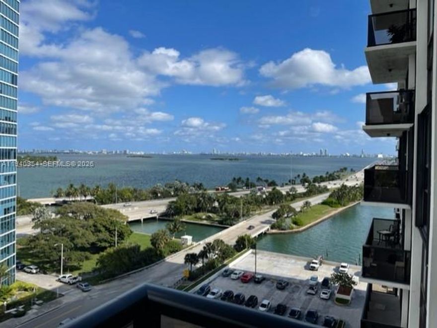 Stunning waterfront condominium featuring an open European-style kitchen with granite countertops, dark wood cabinetry, and stainless steel appliances. Laminated wood flooring throughout and a spectacular bay view with desirable northeast exposure. The building offers resort-style amenities including five tennis courts, a fully equipped gym, on-site deli, dry cleaning services, and hair salon. Ideally located within walking distance to Midtown Shopping Center and Midtown Residences, just five minutes from South Beach and five minutes from Downtown Miami, Bayside Marketplace, and Kaseya Center.