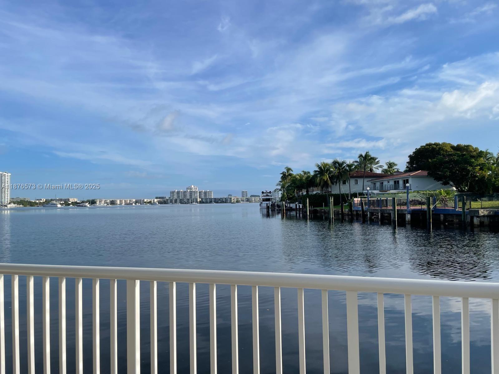 Spacious and bright 2/2 corner unit in building located in between the Intracoastal Waterway and Maule Lake. This larger unit offers an open, airy layout with plenty of natural light. The pool overlooks the waterway and there is a nice large area you can reserve for entertainment. Well maintained building with 40- & 50-year certifications and SIRS completed. Strong management team in place, giving you peace of mind while you enjoy the best of coastal living. Just 1.5 miles to Sunny Isles beach, walking distance to top restaurants, grocery stores, shopping, and entertainment. The balcony overlooks the Oleta State Park that is across the street, which offers plenty of recreational activities.