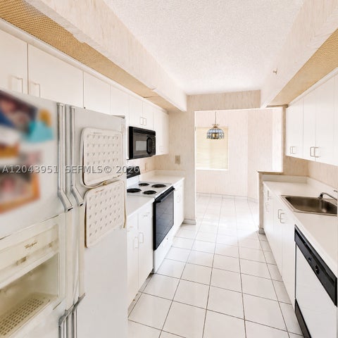 Photo of 901 SW 141st Ave #304M, Pembroke Pines, FL 33027 (MLS # A12043951)