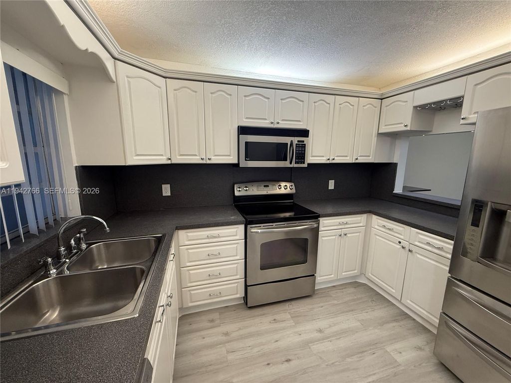 Photo of 9470 Live Oak Pl #104, Davie, FL 33324 (MLS # A11942766)