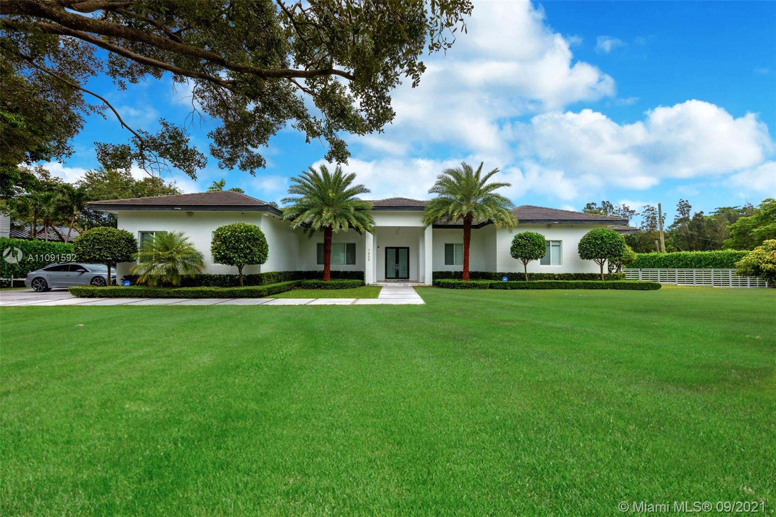 One-of-a-Kind 6,621Sq Transitional Modern Home in Pinecrest, New construction set on 38,768 Sq to enjoy spacious open living, this Estate offers itself as the perfect canvas for art. High ceilings throughout the house, Smart Home, Surround sound system. Open plan living and dinning, two family rooms one of them can be used as an office or game room, Full Open Bar with marble counter top, Open Kitchen with top of the line appliances and custom gabinetes, Wine Cellar. Featuring 5 bedrooms and 6 baths, oversized Master bedroom, his/her custom walk-in closet, large master bathroom. The covered terrace and pool area create a wonderful space for entertainment, Estate of the art BBQ Area, Industrial hurricane proof garage doors, enclosed 6 car garage. Luxury Florida Lifestyle inside & Out.