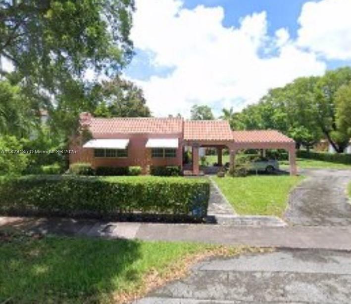 Nestled on a spacious 15,000 sq ft corner lot this classic two bedroom two bath residence offers timeless appeal & exceptional opportunities for investors or end users alike. Featuring a versatile den perfect for a home office or additional living space, this property boasts solid construction and good bones ready for your vision. Roof was updated 2019 providing peace of mind & a strong foundation for future improvements. The detached garage offers excellent storage, workspace, or conversion possibilities. Whether you choose to renovate, expand, or build new, this property presents a rare chance to maximize value in sought-after Coral Gables. With lush surroundings & an unbeatable location near shops, dining, and top schools, this is a prime investment opportunity you don’t want to miss.