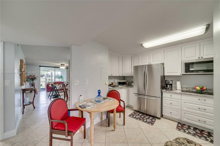 Kept in immaculate condition which has been upgraded with the last year. This 2 bedroom 2 bathroom ground floor unit features a new concept of interior design which outlines the essentials of a classic timeless contemporary style. State of the art chef's kitchen with sleek countertops, identical  countertops and backsplash with an elegant stone design , contemporary white shaker cabinets, crown molding and stainless steel refrigerator, cooktop stove with a convection oven and microwave. Front load washer and dryer.  Diagonally installed ceramic floors. Eastern exposure view from the patio. Which looks onto the manicured landscaping. That is walking distance from the nearby satellite pool. PAID UP REC LEASE.