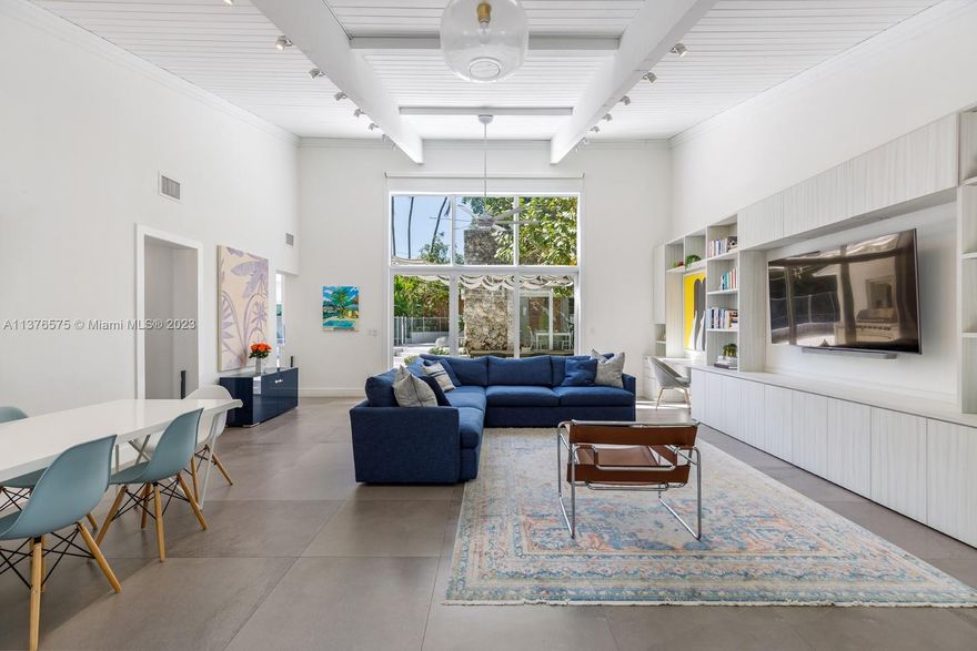 Step inside the ultimate Coconut Grove home with an abundance of natural light, warm vibes + cool breezes. This impeccably-renovated + designed home is perfect for a new homeowner who is ready to take advantage of all that the South Florida lifestyle has to offer. Leave all the sliding glass doors open to enjoy true indoor/outdoor living. The main home has three bedrooms, renovated bathrooms + a striking open living room with high vaulted ceilings + oversized windows. Across the resort-like patio sits a 100-year-old guest cottage that has been renovated + equipped with a living area, kitchenette, bedroom + full bath. Metal roof, pool, hurricane impact windows & doors, new tankless water heaters, new kitchen appliances, outdoor shower and more. Move on in!