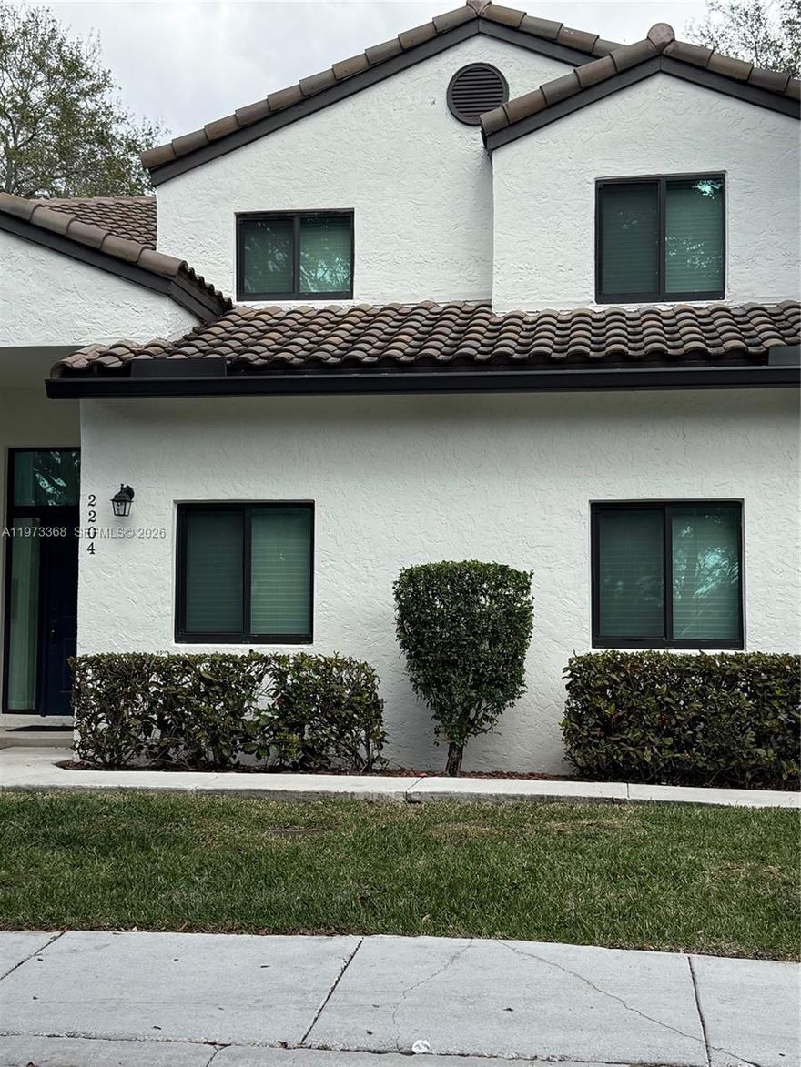 Beautifully Maintained 3-Bedroom, 2-Bath Lakefront Coach Home with Stunning Views! Welcome to this immaculate, move-in-ready residence in the charming Carriage Homes community. Perfectly positioned along the lake, this bright and inviting home offers peaceful water views from your private screened-in balcony — the ideal spot for morning coffee or evening relaxation.Inside, you’ll find a thoughtfully designed layout with generous living space. The spacious primary suite features a walk-in closet and en-suite bath. The kitchen is both stylish and functional, showcasing a pantry, and a sleek contemporary design that flows seamlessly into the main living areas. Additional highlights include a newer A/C system, full-size washer and dryer, an enclosed back patio, and abundant natural light throughout the home. Enjoy truly low-maintenance living with an HOA that covers roof and gutter maintenance, exterior painting, and meticulously maintained landscaping that keeps the community looking pristine year-round. Located within a highly sought-after school district with access to A+ rated schools, this exceptional lakefront home offers comfort, convenience, and scenic beauty — all in one perfect package. Your move-in condition waterfront retreat awaits!