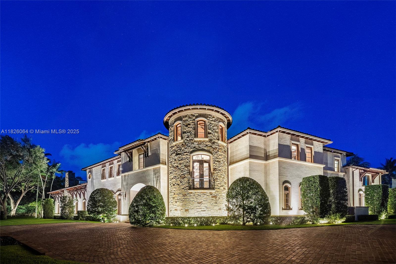 In coveted Suburban Dr, North Pinecrest, designed by renowned architect Ramon Pacheco, discover “The Art of Living Well.” This timeless 7-bed, 6-bath, 3-powder room estate masterfully blends nature and sophistication on a 47,196 SF lot with 11,493 SF under air. Anchoring the home is a breathtaking 1,957 SF Grand Lodge Room with a full wet bar and wine room, leading to a chef’s kitchen. Luxurious primary suite with private terrace and morning kitchen. Additional features include a soundproof media room, commercial-grade elevator, 3-car garage with 7-car capacity via triple stacker Omer lifts, and a 2-bed, 1-bath guest house. A redesigned breezeway connects to resort-style amenities, offering seamless indoor outdoor living in an exceptional, enduring retreat