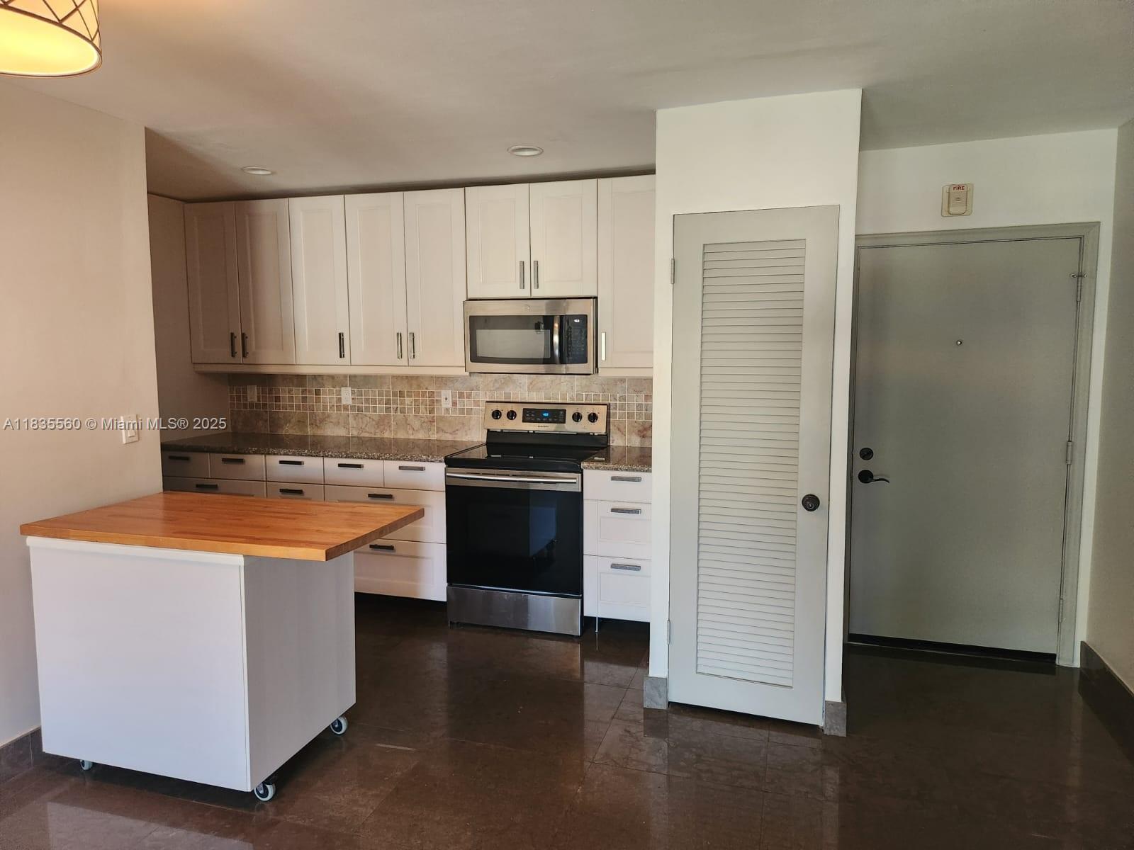 Priced to sell! This beautiful unit has several enhanced features: limestone floors add elegance and durability, and recessed lights enhance ambiance. The kitchen is equipped with SS appliances, a granite countertop, and a stylish backsplash. Costume ELFA closets and the impact windows provide safety and energy efficiency. Two storages that no other unit has. This well-kept community offers the following amenities: a swimming pool perfect for relaxation and exercise, a Bar-B-Q area to gather with family and friends, and a community room with a pool table to do tournaments with family and friends. Close to Wilton Manors, known for its vibrant restaurants, shops, and entertainment. Just a short drive to Las Olas Beach.