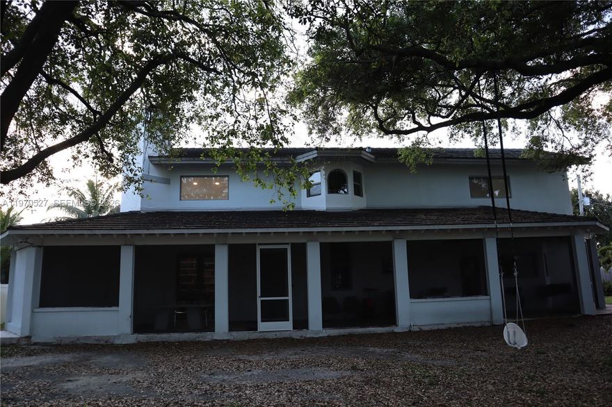 A unique opportunity in North Miami Beach, tucked behind private gates and offering exceptional privacy and outdoor living on a beautifully landscaped lot. The home features an expansive covered patio running the length of the residence, along with a spacious second-floor terrace ideal for relaxing or entertaining.

The 4 bedroom, 3 bathroom main home includes Andersen impact windows and doors, a generously sized chef’s kitchen, an Italian tile roof, and soaring double-height ceilings. A spiral staircase leads to a loft area, adding unique character and additional usable space.

Set on a 14,816 square foot lot, the property also includes a fully equipped guest house with its own bedroom, bathroom, living area, dining space, and kitchen, ideal for guests, extended family, or additional income.

An adjacent 14,476 square foot lot is also available for purchase (MLS A11971875), offering rare opportunities for expanded privacy or future development.