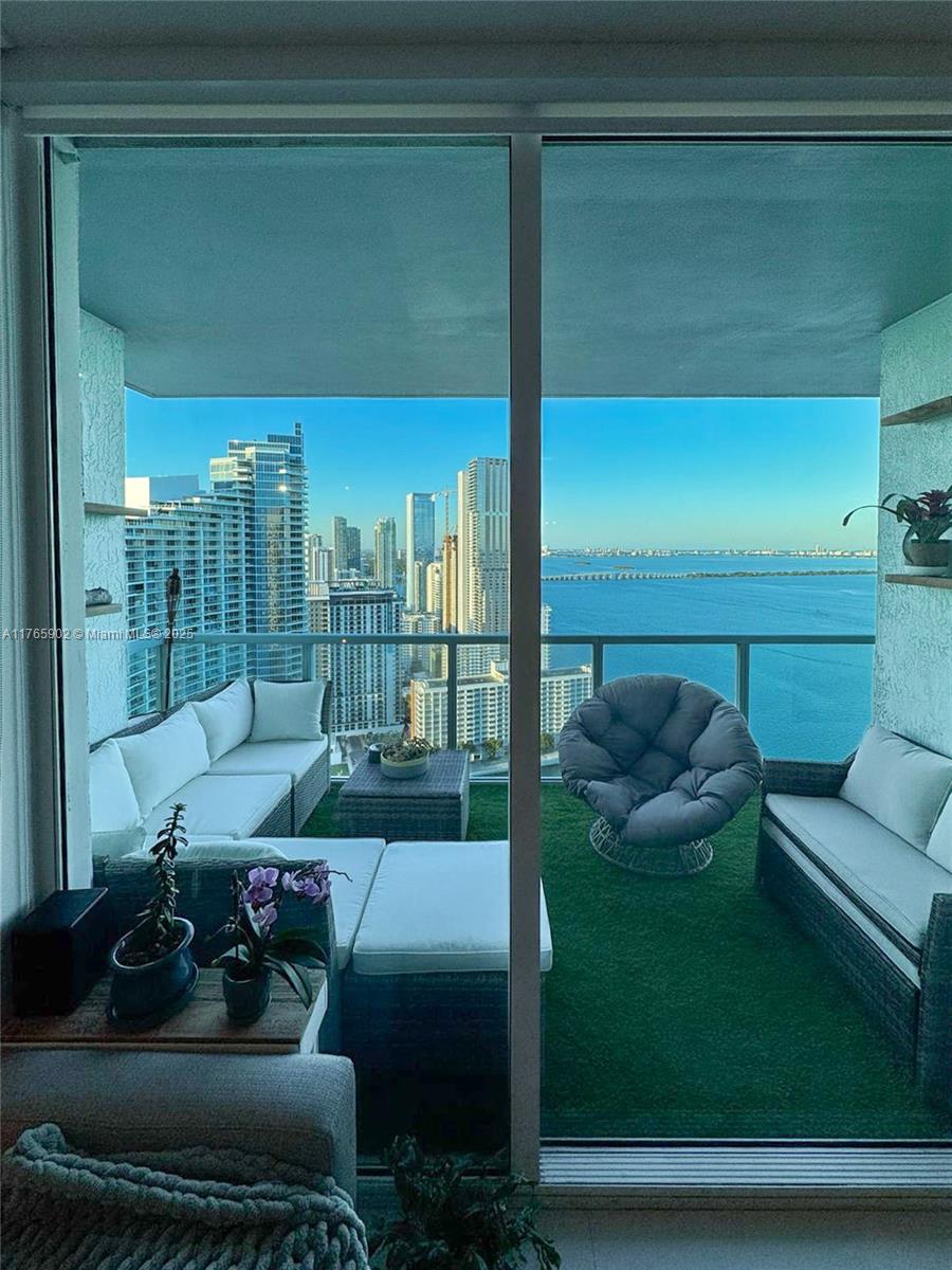 Incredible 2 bedroom plus den and 2.5 bath on the 39th floor at the sought after Quantum on the Bay. This partially furnished unit features a wrap-around balcony with breathtaking direct views of the bay and city views upgraded with porcelain floors, beautiful sliding glass doors in the den to make it a 3rd bedroom or an office space. Master bedroom has a tub and stand up shower. Nice wooden closets in both bedrooms. Great amenities include 2 pools, 2 floor fitness center, sauna, theatre 24-hour security and valet parking and much more. centrally located in Edgewater with Margaret pace park right across the street. Close to Wynwood, the design district, South Beach and minutes to the airport. This is a must see property!