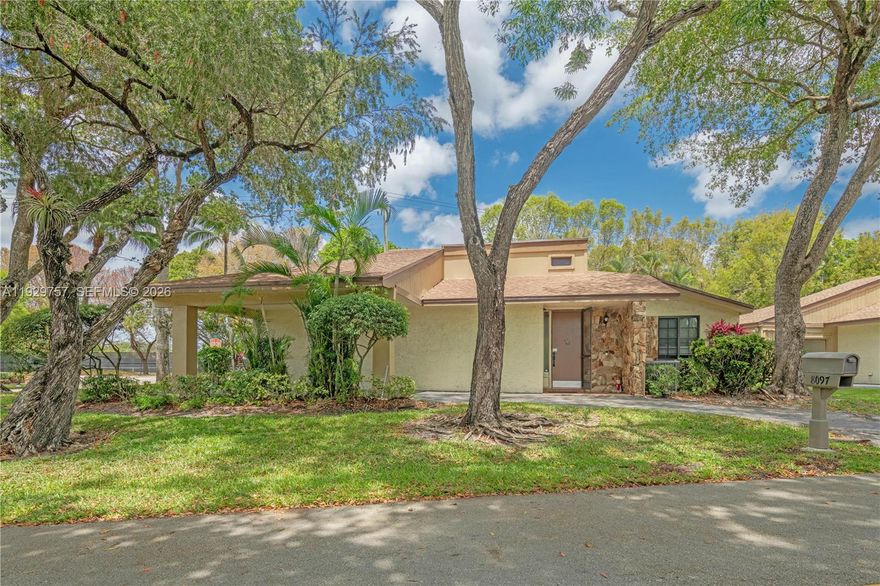 Stand-alone villa. See virtual tour! 5% deposit financing available for qualifying Buyers. Welcome to this hidden gem at Villas at Woodmont. This beautifully updated home features a very spacious, split-bedroom layout, open kitchen, spacious common areas perfect for entertainment, and tile flooring throughout. Relax! The roof was replaced in '23. The flat roof was replaced in '21. The A/C was replaced in April of 2024 [REME HALO LED air purifier & an EZUV coil purifier]. The water heater is '25. Rest easy knowing the home has all impact glass throughout and a large, screened Florida room with ample space for entertainment, a home gym or even a dance. The master suite offers a walk-in closet, dual sinks, and separate shower. Maintenance includes internet, cable, HBO, landscaping, tree trimming, irrigation maint., grounds pest control, appliance repair contract.