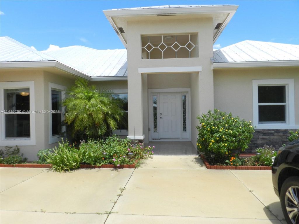 Photo of 104 Springhill Dr, Jensen Beach, FL 34957 (MLS # A11416290)