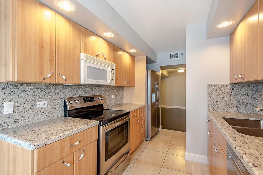 Spectacular turn-key furnished condo with stunning views of the ocean, intra-coastal & pool area. This large 1-bedroom, 1.5 Bath unit features a spacious living room, formal dining used now as a family room, impact windows/doors, wood flooring and no popcorn ceiling.  The updated kitchen boasts granite countertops, a breakfast area and washer/dryer.  Deeded 2-car tandem parking spaces.  Prime location steps from Hollywood Boardwalk, known for its shops, beachfront restaurants & yearlong activities + live music. Resort style amenities include 2 heated pools, sauna, BBQ, fitness center, tennis, pickle ball, basketball courts, bike storage, billiard room, clubhouse-clubroom & ocean access. No Special Assessment.  Easy to show.  Contact listing agent.