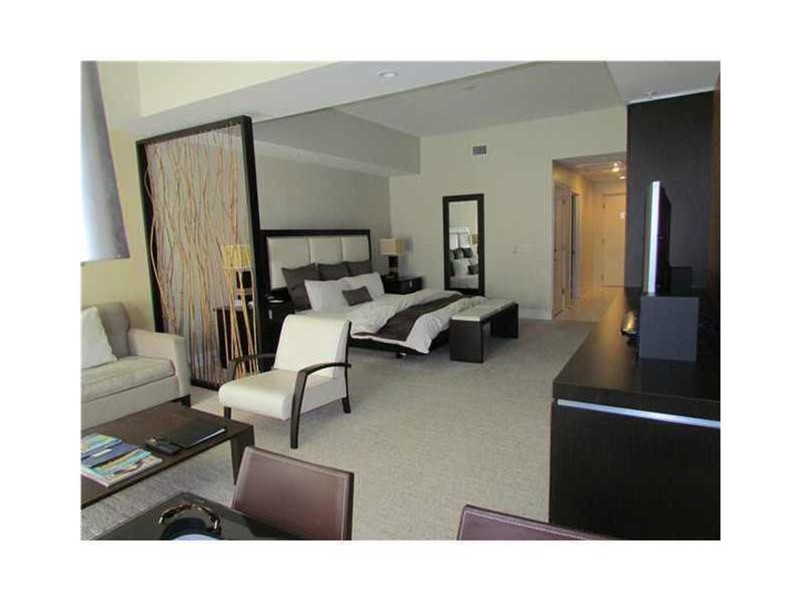 FORECLOSURE PRICE!!!!  Beautifully furnished and finished studio at Provident Doral at The Blue. Conveniently located across the street from Downtown Doral and Trump National Doral Golf Club, The Blue is also near malls, major highways, and airports.  Rig ht in the heart of Doral. Priced lower than any other unit in the building. Generate immediate income through on site rental program.