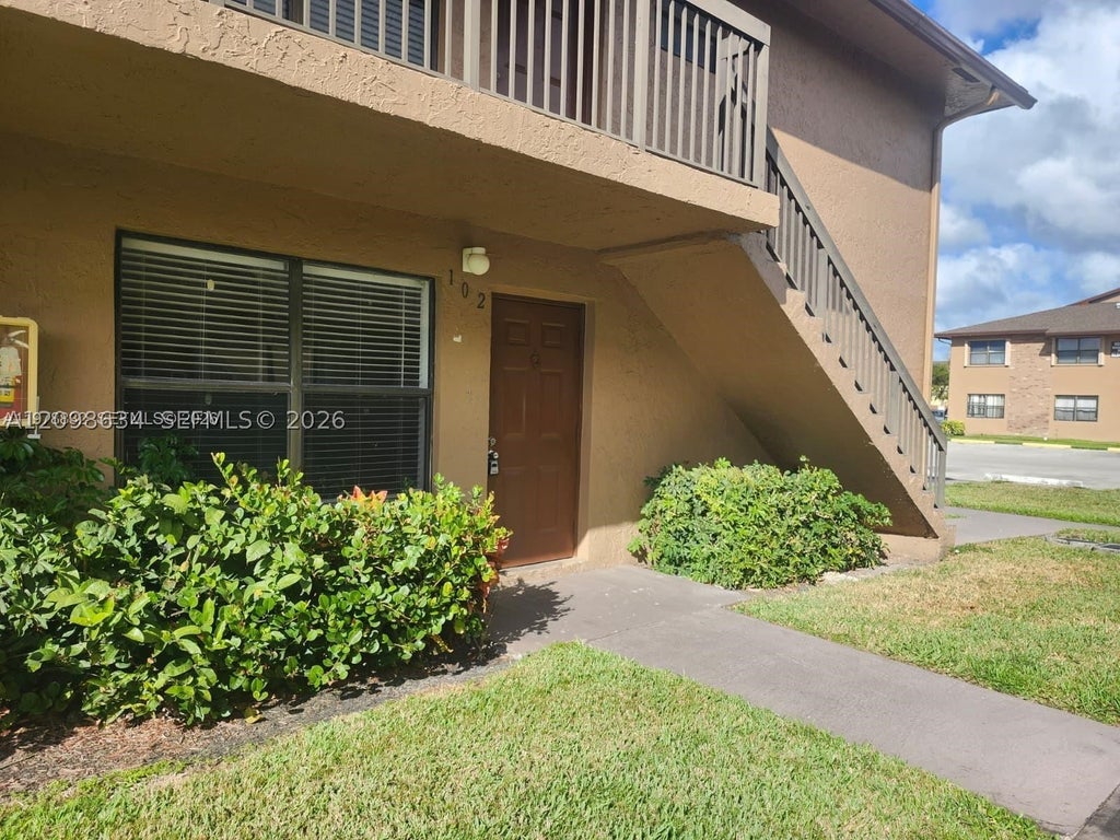 Photo of 10037 Winding Lake Rd #102, Sunrise, FL 33351 (MLS # A12098634)