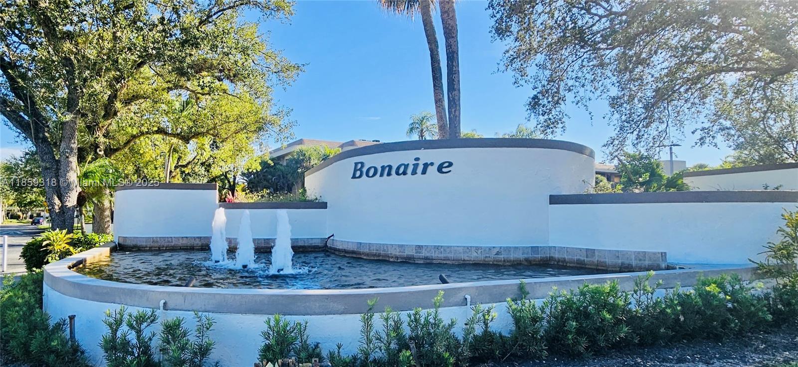 Step into a home that feels as good as it looks. This light-filled 2-bedroom, 2-bath corner unit in the gated, all-age community of Bonaire at Woodmont offers just under 1,500 sq ft of stylish comfort. Sunlight streams through impact windows, highlighting the wood plank vinyl floors, designer kitchen with stainless steel appliances and beautifully updated bathrooms. Custom-fitted closets add a touch of elegance and exceptional organization, while dual screened patios create inviting spaces to enjoy morning coffee or evening breezes. A private laundry room and smart layout make everyday living easy. Perfectly situated minutes from shopping, dining and A-rated schools, this turn-key home is ready to welcome you!