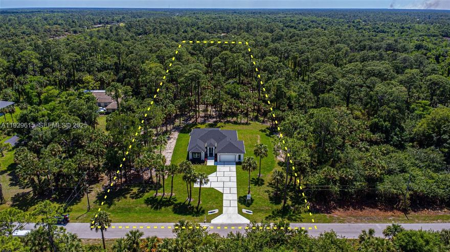 Imagine waking up in a serene paradise where nature’s beauty meets modern luxury. Welcome to Golden Gate Estates — your dream home awaits! Set on 2.73-acre 100% upland lot, this masterpiece by Terranova Construction Group redefines elegance. Featuring 4 spacious bedrooms, 3 full baths, and 1 stylish half bath, plus a grand great room, cozy family room, laundry area, and a 2-car garage with extra space for a utility vehicle — every detail exceeds expectations.  
Inside, you’ll find premium finishes: sleek impact windows, 24x48 tile floors, glass shower dividers, and modern cabinetry. Stay connected with an electric vehicle charging outlet.  
Outdoors, relax on the concrete driveway and covered lanai, and enjoy pure water through a state-of-the-art reverse osmosis system. With ample space to add your dream pool or guest house, this retreat blends privacy and sophistication.  
Located in a growing area with no HOA restrictions, this is more than a home — it’s an opportunity to invest in your lifestyle and future. Discover the perfect balance of modern design and natural tranquility today!