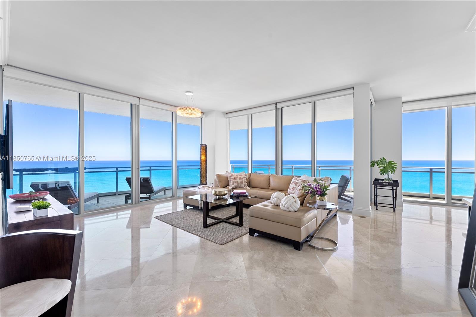 Experience the finest resort living at One Bal Harbour, one of Bal Harbour's most luxurious oceanfront building. This fully furnished 3 bed /3.5bath offers panoramic views of the Atlantic ocean, white sandy beaches, intracoastal waters and Miami Skyline and features 10’ ceilings, wrap around balcony with access from every room, private elevator, gourmet kitchen with gas range, marble floors, walk in closets, built-ins. Enjoy resort amenities of the Ritz Carlton with beach service, pool service, restaurants, concierge, private fitness center, theater room and Exhale Spa. Amazing location situated on the jetty and Bal Harbour's walking/jogging/bike path. Relax while watching yachts and boats entering and leaving the Haulover cut from your balcony.
