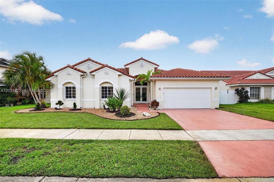 Discover refined living in this exceptional 4 bedroom, 2.5 bath home within the exclusive gated community of Estancia at Twin Acres. Blending timeless elegance with modern comfort, this beautifully maintained one story residence showcases soaring ceilings, expansive living spaces, designer finishes, & abundant natural light throughout. Enhanced with valuable updates for comfort & peace of mind, the home features a 2021 roof, 2017 A/C, 2021 water heater, accordion shutters, & a new impact front window installed in 2023. Exterior improvements include a PVC fence, sprinkler system, updated gutters, & maintained landscaping. Thoughtfully designed for elevated living & entertaining, the home offers formal living & dining spaces, an inviting family room, & a spacious kitchen with quartz countertops, SS appliances, white cabinetry, & a cooking island. Privately situated, the oversized primary suite offers a true retreat with expansive windows, separate his & her closets, & a spa inspired bathroom featuring dual vanities, quartz counters, a soaking tub, & separate glass enclosed shower. Outdoor living is equally impressive with a large screened patio overlooking the oversized backyard, offering exceptional space to relax, entertain, or create your own private outdoor oasis. Ideally located in the heart of Pembroke Pines near top rated schools, premier shopping, dining, parks, & major highways, this exceptional residence offers the perfect balance of luxury, comfort, & location.