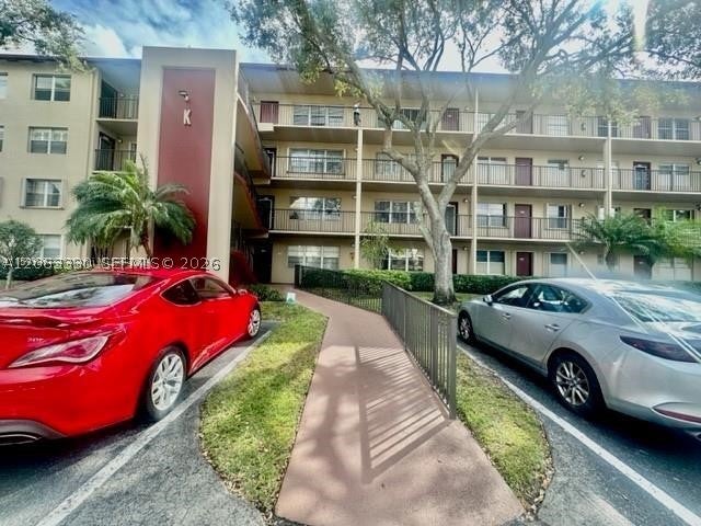 Photo of 801 SW 133rd Ter #105K, Pembroke Pines, FL 33027 (MLS # A12063330)