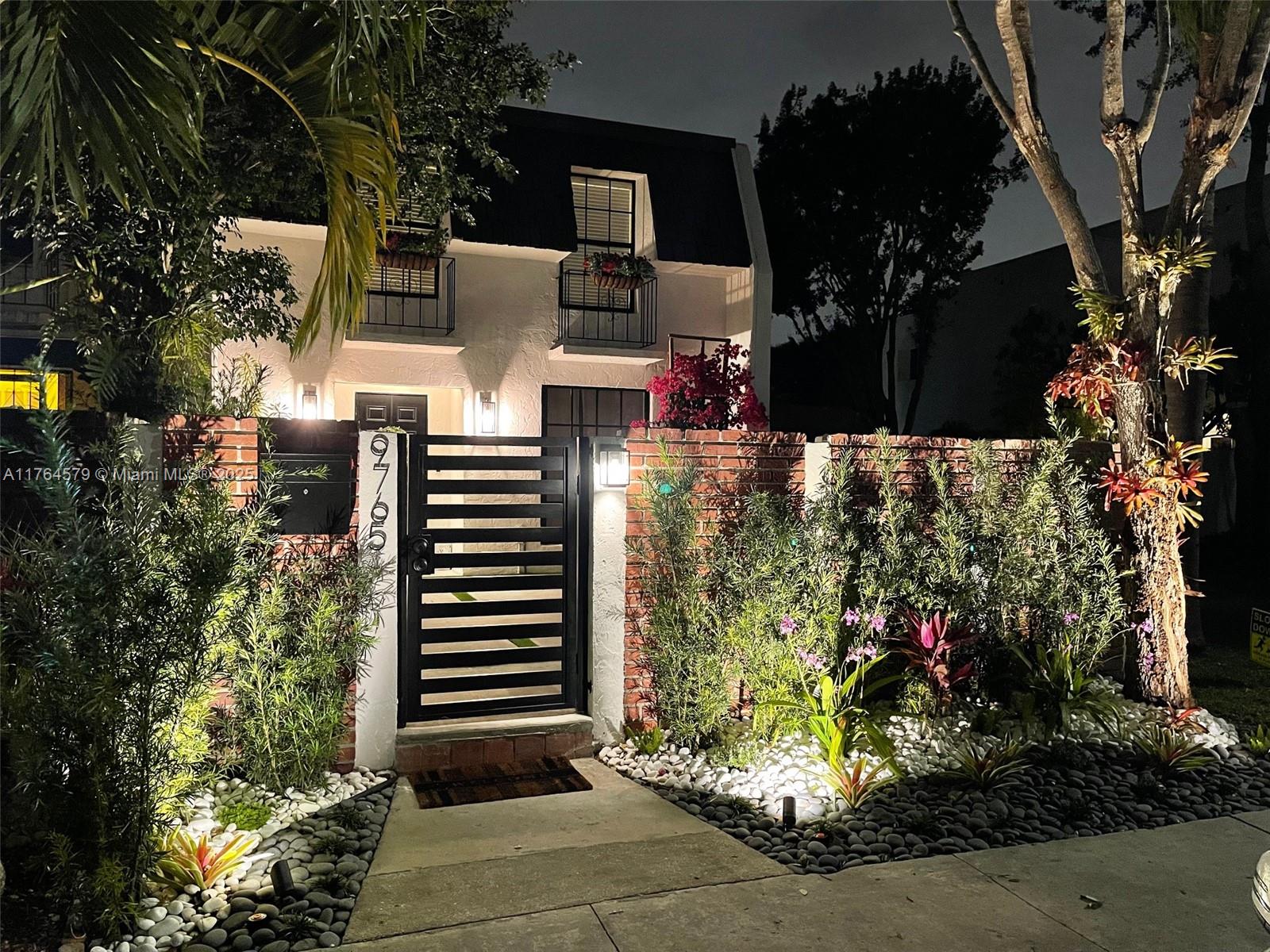 Rarely available! This fully renovated 2-Story, 3-Bed, 2.5-Bath Townhouse offers 1,630 sqft of elegant living. New impact windows and doors throughout. Step into the airy formal living room, then flow into the expansive family room connected to a state-of-the-art custom kitchen featuring an oversized island and brand new SS appliances. Primary suite features an ensuite bathroom & walk-in closet. Outside, the beautifully landscaped front garden enhances the home's curb appeal, while the large covered backyard provides a serene, private retreat perfect for entertaining. Additional perks: full-size laundry, ample storage, upgraded EV charger, two assigned parking spaces. Nestled in a quiet corner of a great neighborhood near top schools, parks, & shopping, with easy access to major highways.