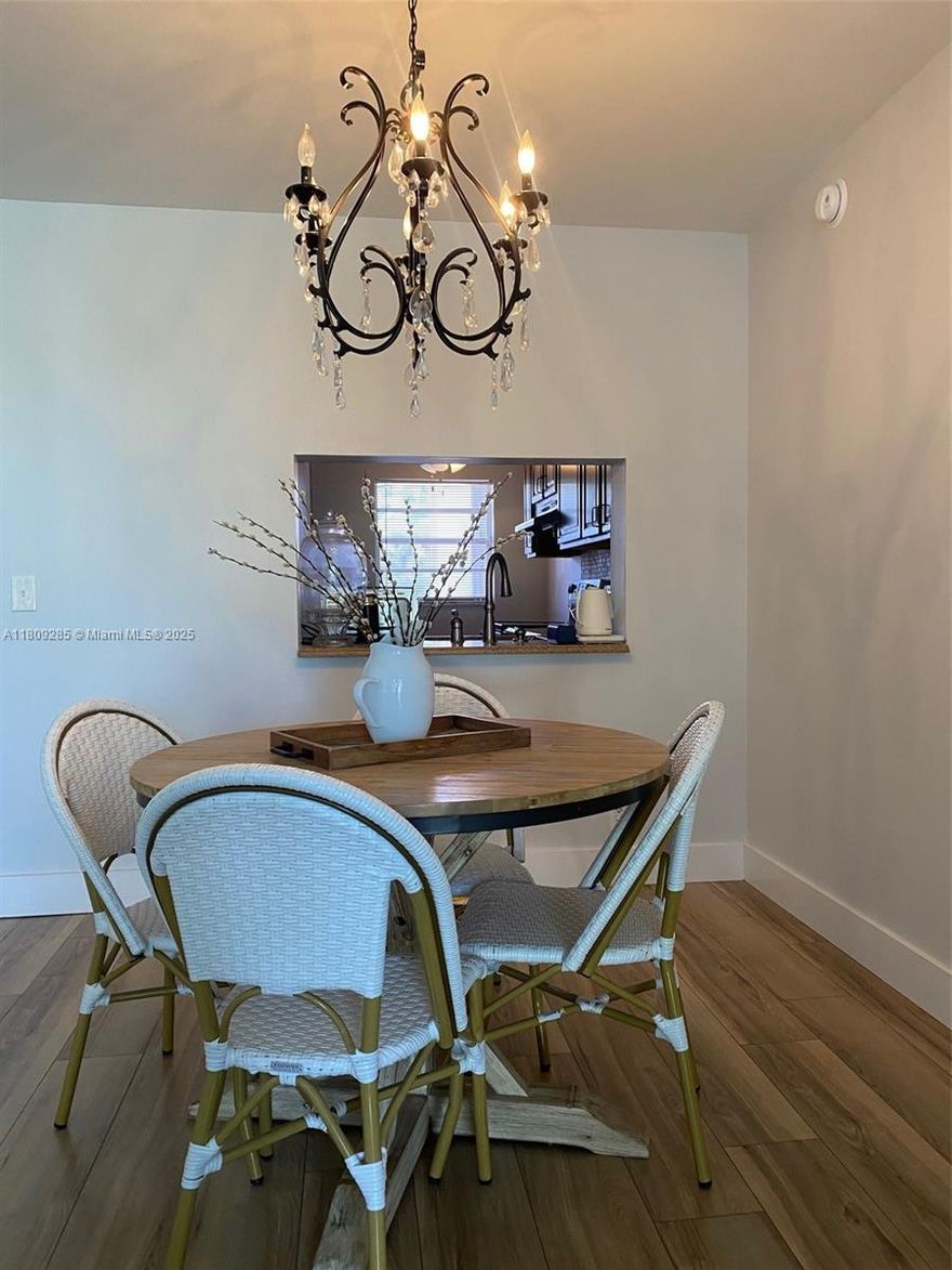 One of the most beautiful units in Poinciana! This well-maintained, smoke-free home features wood flooring throughout, marble in the bathrooms, and porcelain tile accents. The upgraded kitchen is equipped with stainless steel appliances, and the ceilings have been updated with the popcorn finish removed. Freshly painted and move-in ready. Seller will cover the 40-year certification special assessment at closing, building has a brand-new roof, HOA requires 10% in escrow. Don't miss this exceptional opportunity!