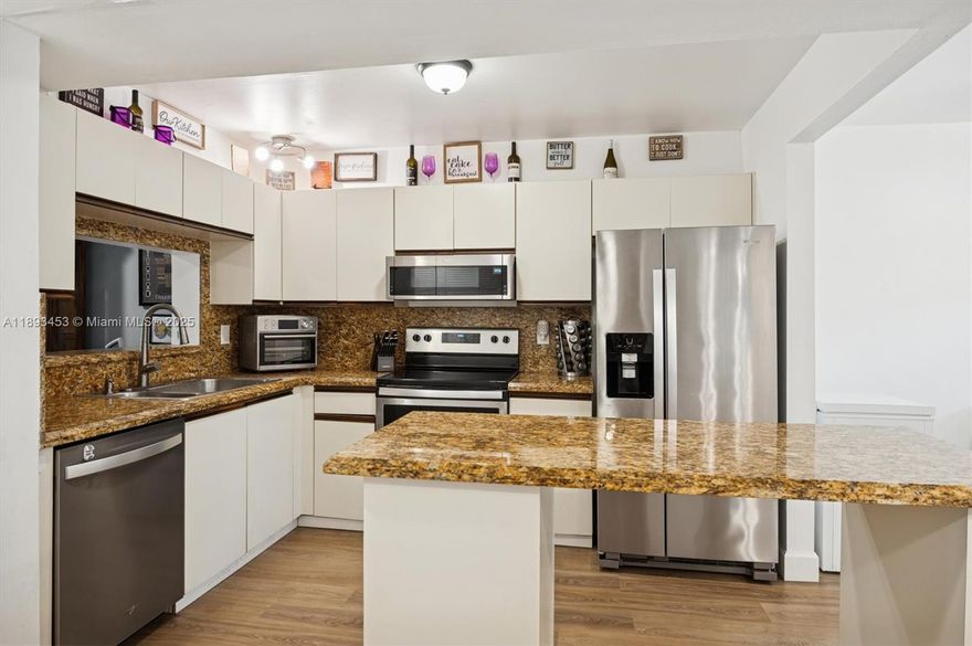 Welcome to this 2/2 condo located within a secure gated community. This stylish residence boasts vinyl wood flooring throughout the shared spaces, adding a touch of warmth & sophistication. The open floor plan connects the living room, dining area & kitchen, making it perfect for hosting guests or enjoying quiet evenings at home. Beautifully renovated 2nd bathroom. Master bedroom has 2 walk in closets. You'll appreciate the convenience of an in-unit laundry & plenty of storage options. Step out onto your private screened balcony w/ pool view, for savoring your morning coffee or unwinding in the evening  With community features like a swimming pool, hot tub, BBQ area and clubhouse, this condo blends comfort & lifestyle. Seize the opportunity to make this exceptional residence your own!