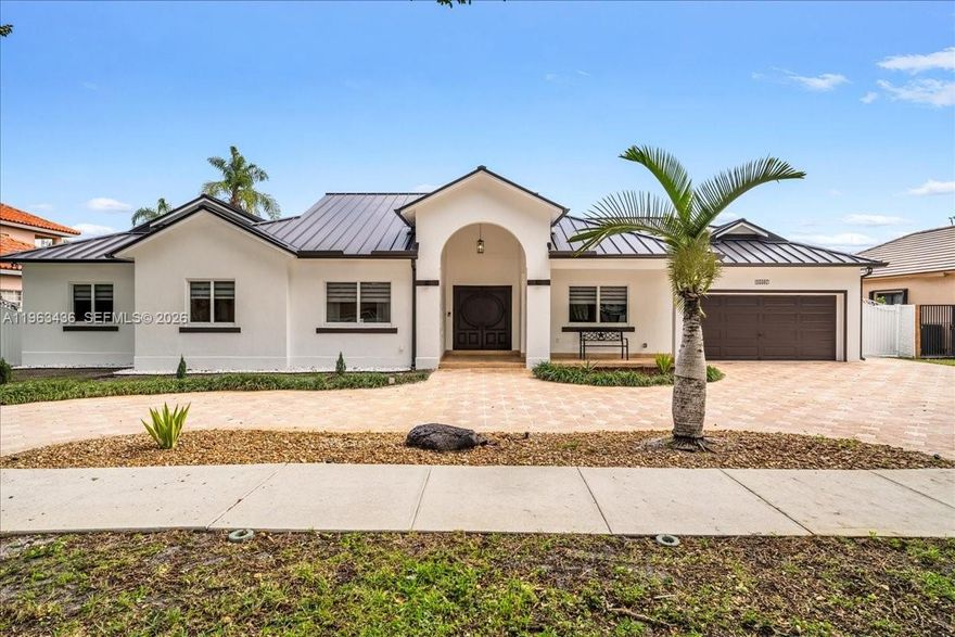 Upgraded single-story home on an oversized 11k+ sf. lot within the private, guard-gated community of Royal Palm Estates. Freshly painted, this 4 Bed / 3 Bath plus office home features wood & marble floors, high-vaulted ceilings, and an open, versatile floor plan filled with natural light. Major upgrades include a new aluminum roof (2025), new insulation (2025), new skim-coat walls (2025), and a new A/C (2023). Protected by High-Impact doors and windows, the home is also enhanced by new LED lighting, a new sprinkler pump (2025), custom wood interior doors, and a circular driveway. The spacious gourmet kitchen offers granite countertops, a center island, breakfast nook, and a new refrigerator (2024). The oversized backyard provides concrete fencing, a large covered terrace, and ample room for a pool and outdoor kitchen. Enjoy privacy, scale, and 24/7 security in one of Miami Lakes’ only fully guard-gated communities, just 25 minutes from Miami and Fort Lauderdale.