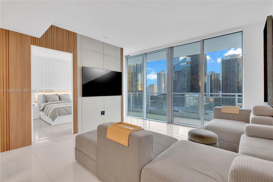 Beautifully upgraded 2BD/2BA residence at Mint with expansive river and skyline views from the 28th floor in one of Brickell’s only gated riverfront communities. This home stands out from the standard floor plan with a reimagined kitchen and entry layout centered around a long dining-size island topped in Arabescato Grigio polished Italian marble. Smart lighting, custom pantry storage, and a relocated washer/dryer create a cleaner, more functional living space rarely found in comparable units. Floor-to-ceiling glass and an open, light-filled layout enhance the home’s spacious feel. The desirable 02 line offers exceptional side exposure and open sightlines rarely found in comparable layouts. HOA includes internet, cable, water, and access to Mint’s resort-style amenities, adding meaningful day-to-day value for owners. Mint offers pool, full fitness center, spa, steam room, sauna, valet, concierge, and children’s playroom, all moments from Brickell City Centre, Downtown Miami, and the Miami River.