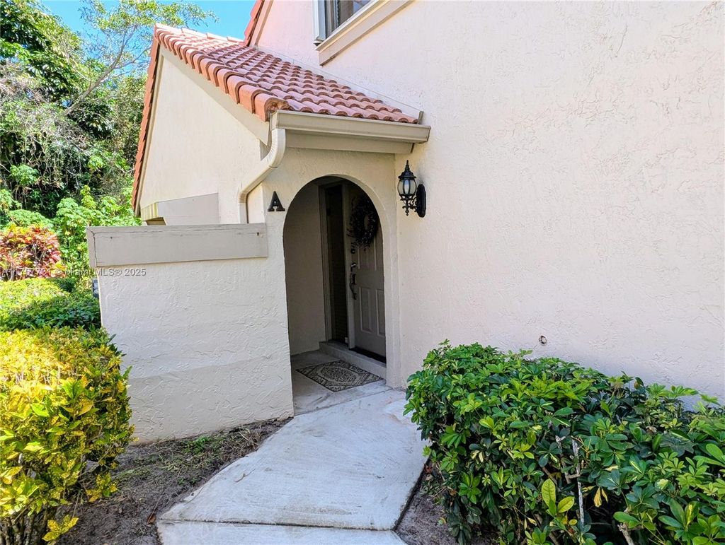 Photo of 5590 Coach House Cir #A, Boca Raton, FL 33486 (MLS # A11757731)