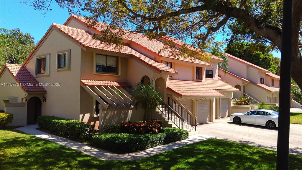 Photo of 5590 Coach House Cir #A, Boca Raton, FL 33486 (MLS # A11757731)