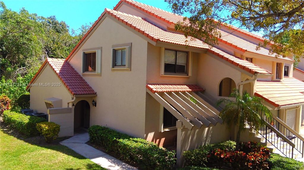 Photo of 5590 Coach House Cir #A, Boca Raton, FL 33486 (MLS # A11757731)