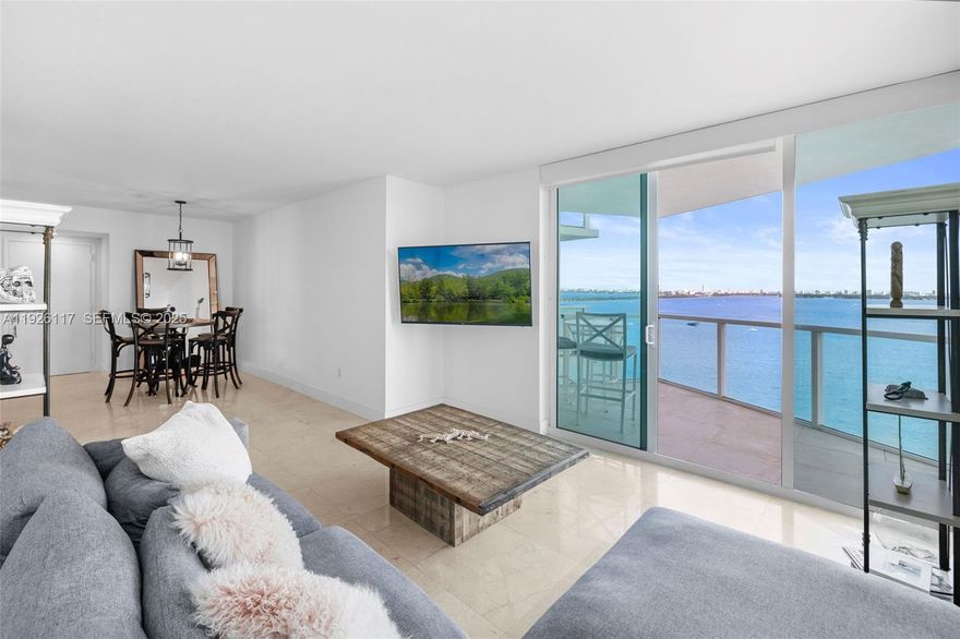 Corner 2-bedroom residence for rent at Onyx on the Bay with open bay and city views. Floor-to-ceiling windows fill the unit with natural light, and a wraparound balcony captures both sunrise and sunset. The open layout features marble and wood flooring, a modern kitchen with stainless steel appliances, and a split bedroom plan offering ensuite baths for both bedrooms plus a separate guest powder room. One covered parking space. Full-service building with waterfront pool, fitness center, spa, sauna, steam room, and 24-hour concierge. Ideally located in Edgewater near dining, shopping, Midtown, Wynwood, and the Design District.