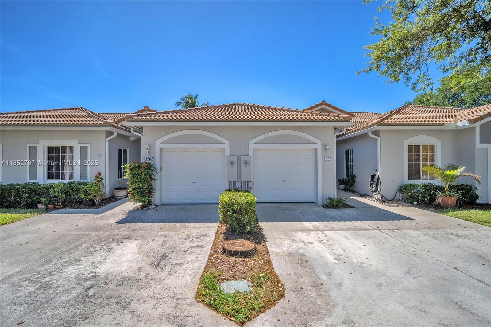 Lowest Priced Villa in the Community. Priced to Sell Fast! This well maintained one story villa with a garage is located in a gated, resort style community and offers a spacious layout with ceramic tile in the main areas, cozy bedrooms, a bright eat-in kitchen, and a primary suite with walk-in closet and private bath. Enjoy a brand-new AC and an open patio perfect for relaxing. The HOA includes roof, insurance, cable/internet, landscaping, and access to top-notch amenities like pools, gym, clubhouse, tennis, pickleball, and more, making this a standout value in today’s market. Move-in ready and priced for a quick sale!