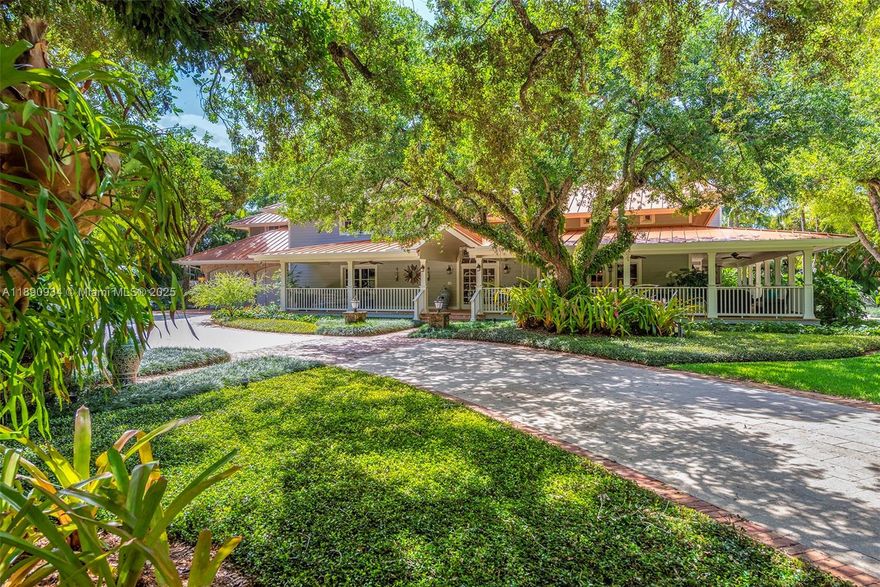 SIGNIFICANT PRICE ADJUSTMENT. Tucked within the exclusive gated community of Banyan Lakes, this custom estate exudes timeless Coral Gables elegance. Set on a breathtaking 50,000+ SF lot, the property is surrounded by majestic live oaks, manicured terraces, and a resort-style lagoon pool—creating a private, park-like retreat. Spanning 8,765 SF, this 6-bedroom, 5.2-bath residence is designed for gracious living and entertaining. The home features a formal living room opening to a serene Zen garden, family room w/ fireplace & custom built-ins, & chef’s kitchen with Wolfe & SubZero appliances, banquette seating, & butler’s pantry. The primary BR includes gym, 2 walk-in closets, & spa-like bath. Additional highlights include white oak floors, impact glass, metal roof, generator, & 2-car garage.