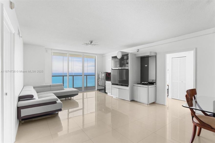 Experience breathtaking direct ocean views the moment you step into this spectacular 2BD/2BA residence in the sky. Positioned in the premier east-facing stack, the most coveted line in the building!

Floor-to-ceiling hurricane impact sliding glass doors connect the living room, dining area, and eat-in kitchen seamlessly to the expansive balcony, creating a perfect indoor-outdoor lifestyle. The open layout showcases abundant natural light, high-quality finishes, and thoughtful craftsmanship.

Arrive home through a semi-private elevator lobby for an elegant touch. Inside, enjoy a sleek contemporary kitchen, oversized chef’s pantry, and the convenience of an in-unit laundry room.

Whether as your dream home or an investment, this property offers unmatched appeal!