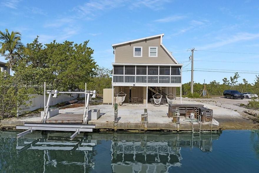 Charming 2BR/2BA Keys home on Upper Sugarloaf. FULL HOUSE GENERATOR WITH TRANSFER SWITCH,
Built on sturdy concrete pilings with Hardie board siding and a metal roof, Large workshop, storage space on first level with Laundry room, this three-story retreat of island living. Inside, you’ll find bright, cozy interiors with bamboo and ceramic tile floors and open living spaces for the relaxed Keys lifestyle. What truly sets this property apart is its rare private boat ramp on a deep-water canal with a boat lift—a feature difficult to replicate under today’s strict permitting process. Enjoy quick access to the open waters. Lot also provides plenty of room oasis to add a pool overlooking the canal. Whether as a full-time residence or vacation escape.