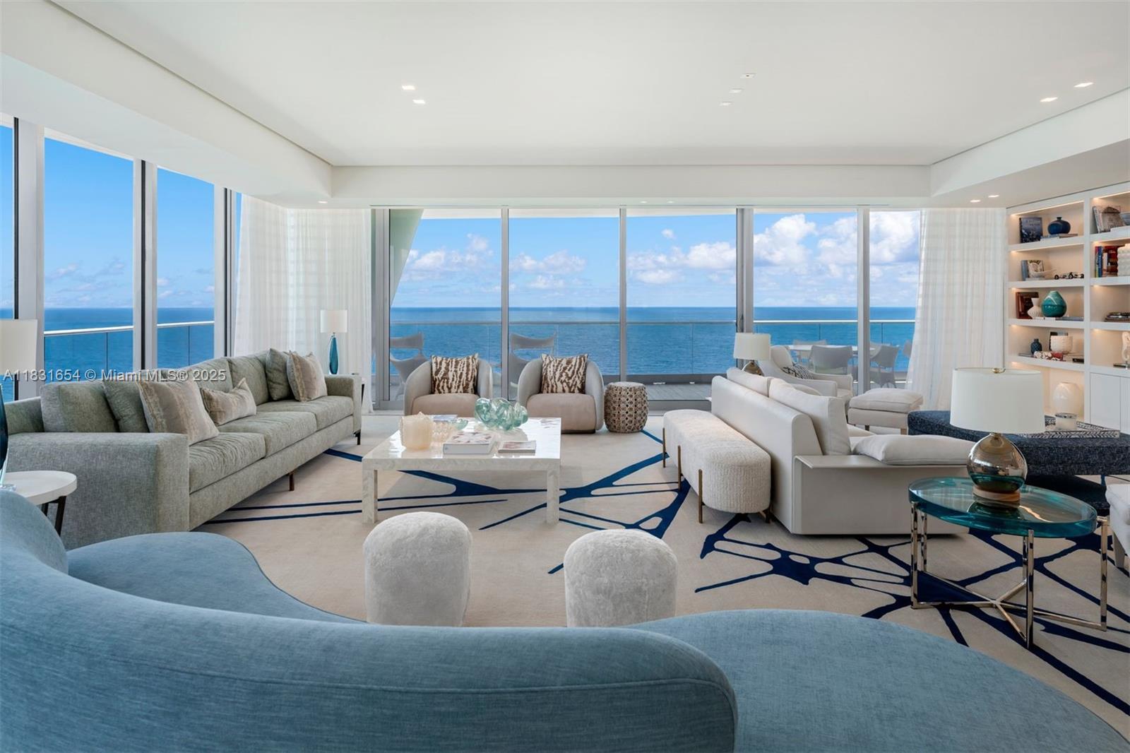 One of Miami's most spectacular condos, Fendi Chateau #1101 is an ocean front masterpiece. Designed & decorated by renowned Brazilian architect Sig Bergamin, this 5bed/6.5 bath 6,726 SF home in the sky exudes beachfront elegance. Perfectly situated taking up the entire north corner, the 1,885 SF wraparound terrace allows for spectacular ocean & intracoastal views. Exquisite interior features include 10' ceilings, teak flooring, Italian Calacatta stone, & smart home system. The oversized primary suite has dual ocean view bathrooms & a closet the size rarely seen in new construction. The Fendi designed eat-in-kitchen is equipped with Gaggenau appliances & wine fridge. A private elevator opens to elegant living areas, formal dining room, & a media lounge perfect for billiards & game night.
