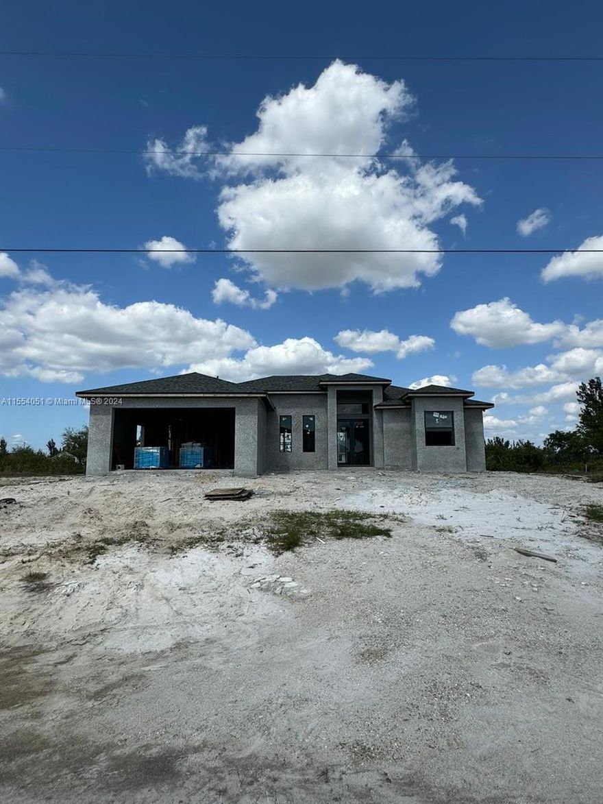 This new construction home in Cape Coral comes with a 5% seller credit that can be used toward closing costs, prepaids, or other allowable buyer expenses—giving you more flexibility at closing. Introducing the "Ella" model, a brand-new construction in Cape Coral, Florida, perfectly situated on a tranquil location backing a lake. This modern beauty offers 3 bedrooms, 2 baths, plus a flex room. The master bedroom boasts his & hers walk-in closets. The master bath exudes luxury with a shower & tub. The open format design features high ceilings & large format tile throughout, creating a spacious & elegant atmosphere. An additional cabana bathroom adds convenience for guests & outdoor entertaining. Step onto the lanai, complete with a wet bar, ideal for hosting gatherings.