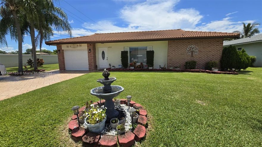 Welcome to your charming 55+ community home! This updated 2-bedroom, 2-bathroom, single-story home offers nearly 1700 sq. ft. of living space with a versatile floorplan, including split bedrooms, ample closet space, a living room, dining area, laundry room, family/Florida room, and a den that can be used as a third bedroom. Enjoy the large rear yard with mango trees, a gazebo, a 1-car garage, a large carport, and a paver driveway accommodating up to 5 cars. Located on a corner lot in the peaceful Westwood Water View community, this home is near major shopping malls and is remodeled and move-in ready.