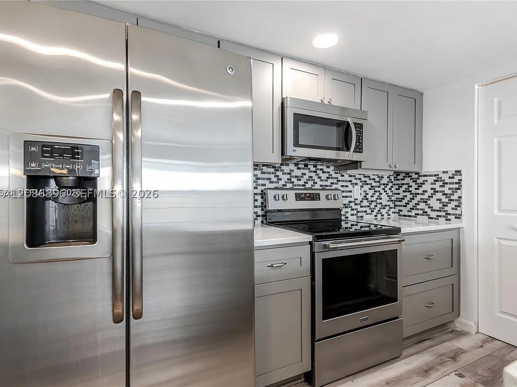 Photo of 5800 Rambler Rose Way, West Palm Beach, FL 33415 (MLS # A12086896)