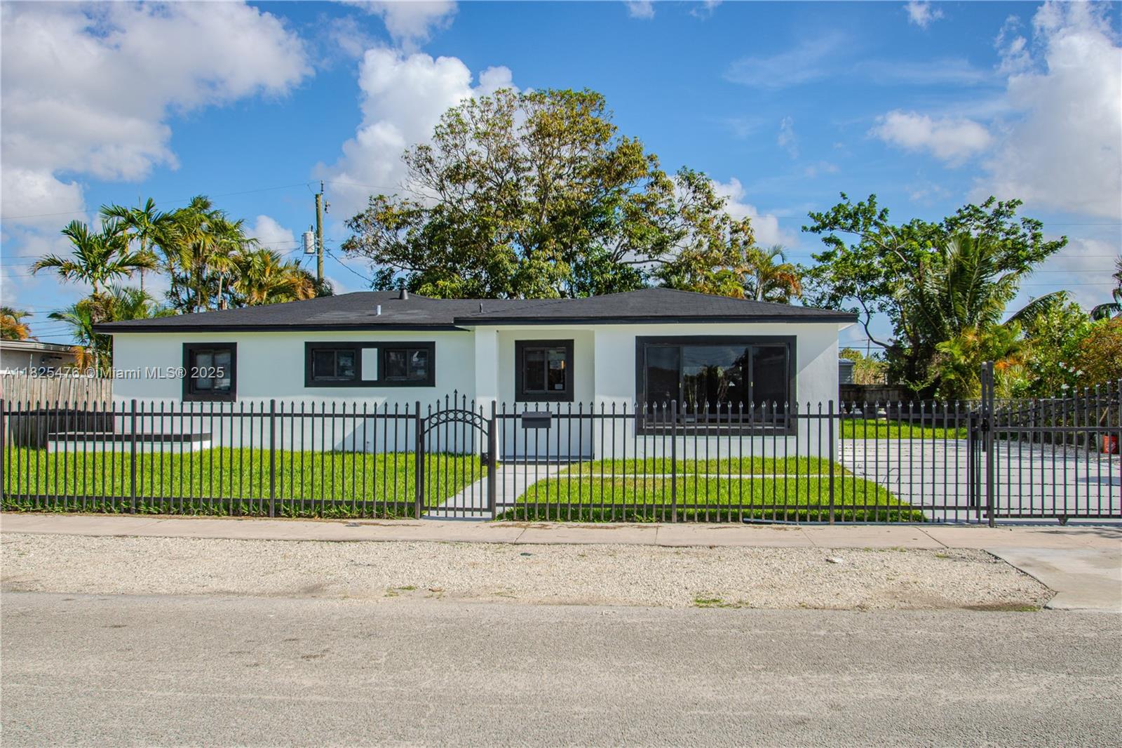 Completely remodeled home. New kitchen, new appliances, new bathrooms, new porcelain tiles, new high-impact windows, new washer and dryer, new driveway, and more. Very spacious and with ample parking. Available immediately.