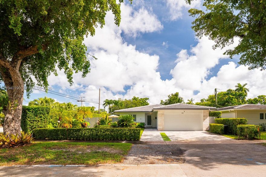 Stunning 1,900 sq. ft move in ready home situated on corner of beautiful tree lined street in Coral gables. It is walking distance to University of Miami and close to renowned dining, shopping, and excellent schools. This home features three bedrooms, two bathrooms, and infrastructure has been fully updated. Updates include: new electrical, mechanical, PVC plumbing, new roof (2024), impact windows/doors/garage door, new driveway, and a whole house Generator with natural gas from city. The contemporary kitchen boasts quartz countertops LG/GE appliances and gas stove. Home includes a two car garage, and exterior deck great for entertaining, and open concept living areas. Experience vibrant Coral Gables living!