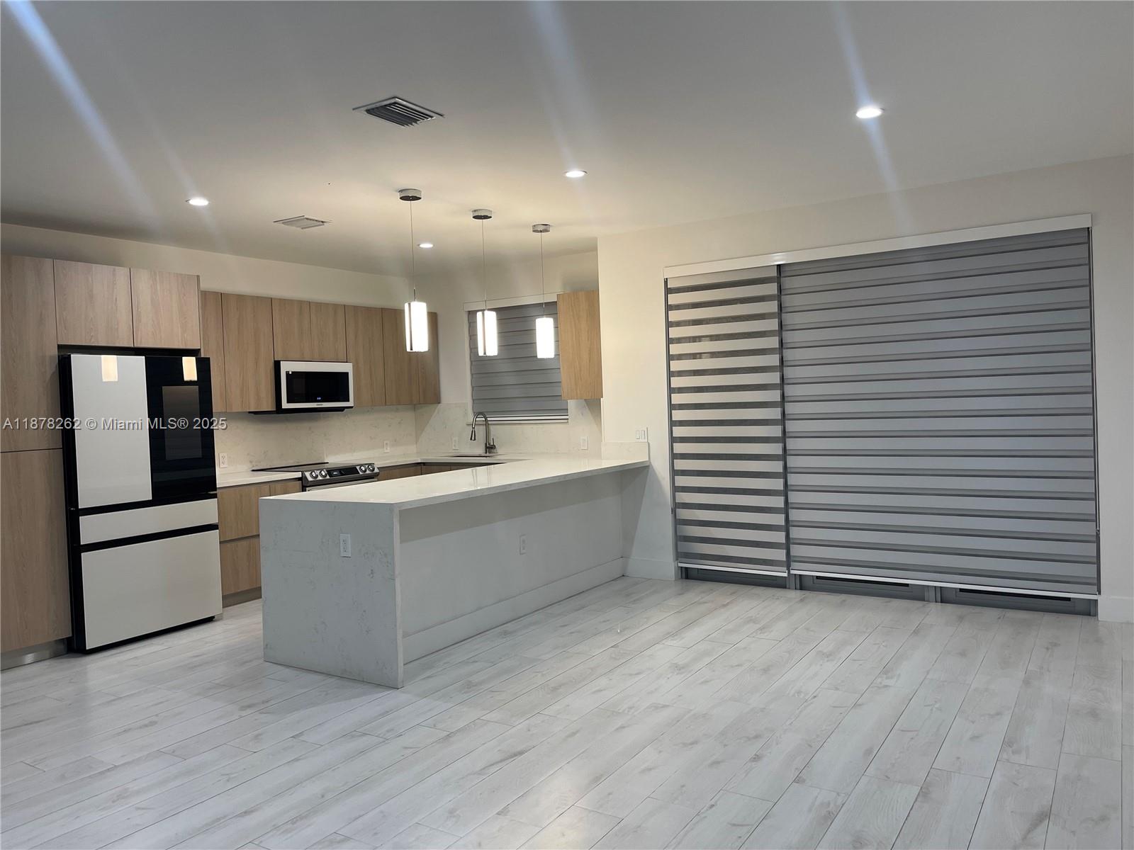 The developer spared no expense in this beautifully designed modern style duplex. Open layout design that features a lovely kitchen with custom wood cabinetry, marble countertops, almost brand-new stainless-steel appliances. Laundry closet with washer and dryer. Beautiful matching tile throughout the living space, bedrooms, and bathrooms. Custom designed closet. Exterior featuring lush landscaping. Concrete pad driveway. Hurricane impact windows and doors. Lighting throughout. Surveillance cameras installed. Electric gate entrance. Do not miss out on this amazing opportunity! Minimum credit score of 650 requested by the owner
