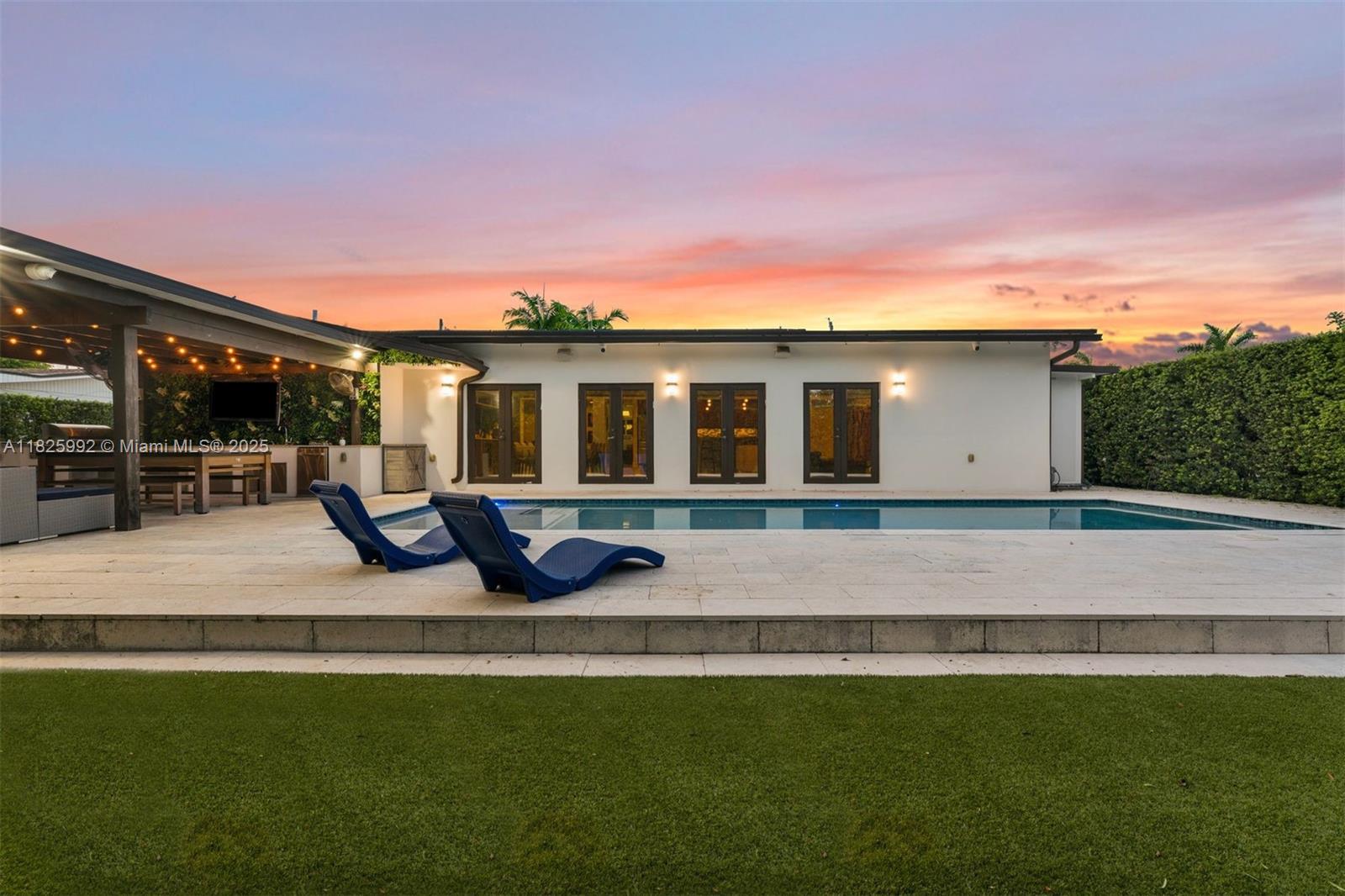 Located in the desirable gated community of Highland Lakes, this beautifully renovated 5BD/4BA home spans 3,000+ SF and offers the perfect blend of modern luxury and thoughtful functionality. Expanded and fully remodeled in 2013, the home features impact windows, new roof, electric, plumbing, plus new A/Cs (2021). Enjoy indoor-outdoor living with an oversized pool, gas + solar heaters, outdoor kitchen, covered patio & pet-friendly turf yard. The custom kitchen includes a dining built-in with wine cooler, while the spacious spa-like primary suite offers a luxurious two-person shower & massive walk-in closet. Other highlights: wellness space with gym, sauna, cold plunge, maid’s quarters, security system, water softener & 2 built-in sheds. Minutes from A-rated schools, Aventura Mall, & I-95.