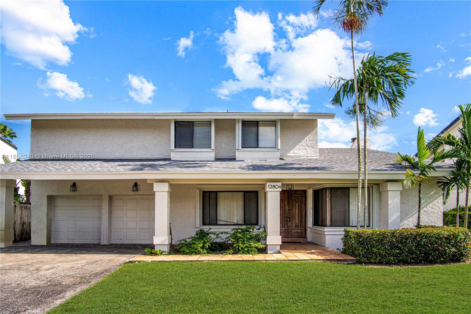 **BY APPT ONLY. Introducing a rarely offered opportunity to get the best lake front view in the whole neighborhood. Spend your days under your shaded patio areas or up on your spacious balcony that has recently been completely re-built & reinforced. Have peace of mind knowing the exterior of this home has been recently painted, stucco and fascia repaired, accordion shutters installed, a 2022 roof and your A/C's are brand new. This home features stainless steel kitchen appliances, new carpet on the first floor and a real wood-burning fireplace with a sunk-in area. The wrap-around bottom floor offers flow-through spaces in a twirling open concept. *Pictures are staged & renovated to show the possibilities * Envision a stunning renovation; the choices are yours - The potential is undeniable.