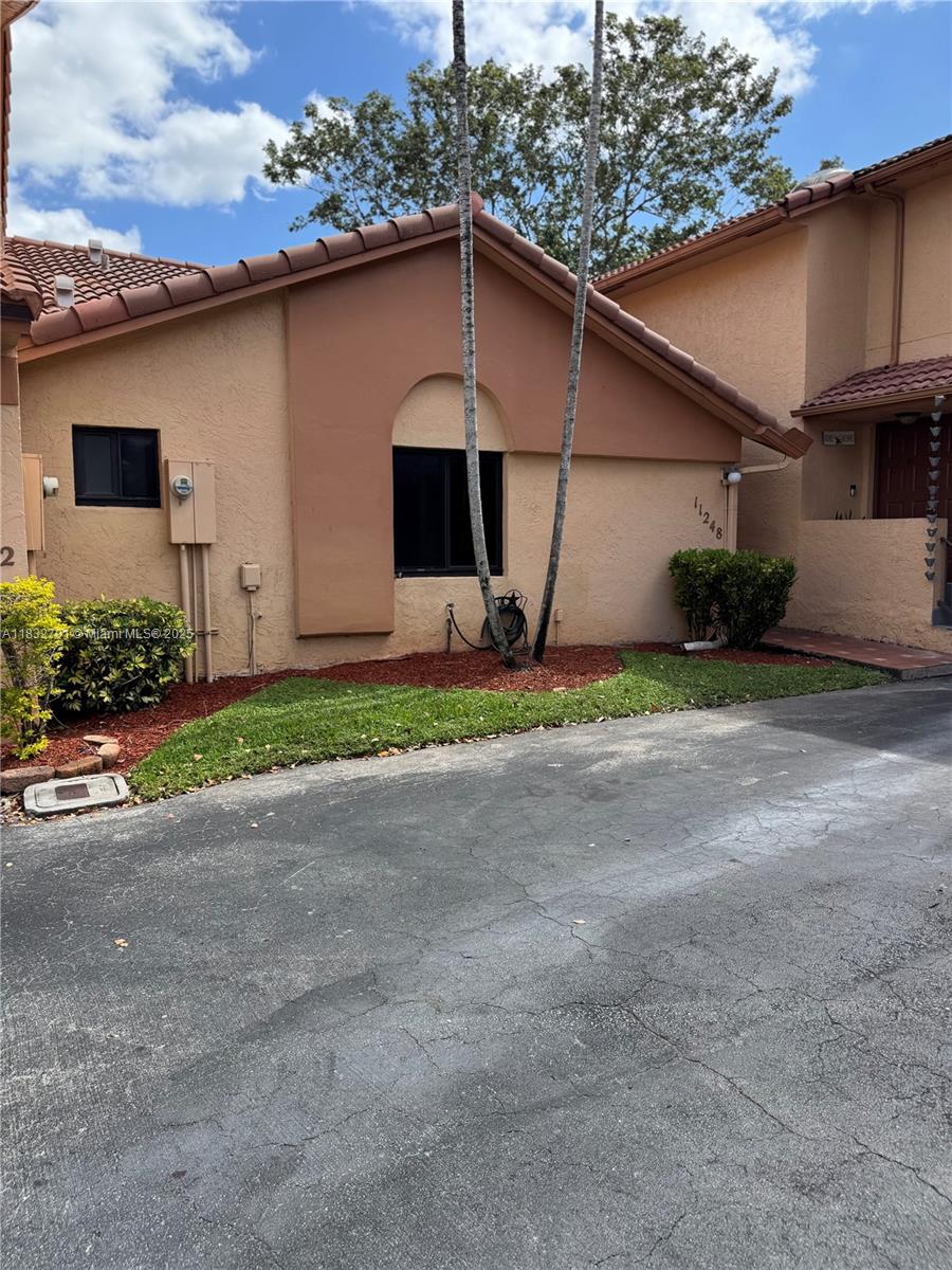 Beautiful 2-bedroom, 2-bathroom condo townhome located in a charming community offering a variety of amenities, including a swimming pool, landscaped grounds, a park, and a private parking space designated for the unit, conveniently situated near major highways, with quick access to I-75 and just 5 minutes from the Turnpike. Only a 10-minute drive to Pembroke Pines Mall and is surrounded by numerous restaurants and retail stores. All appliances included. Showings begin 07/19/25